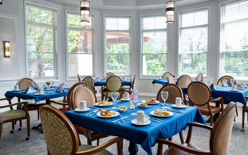 a dining room with tables set for a meal